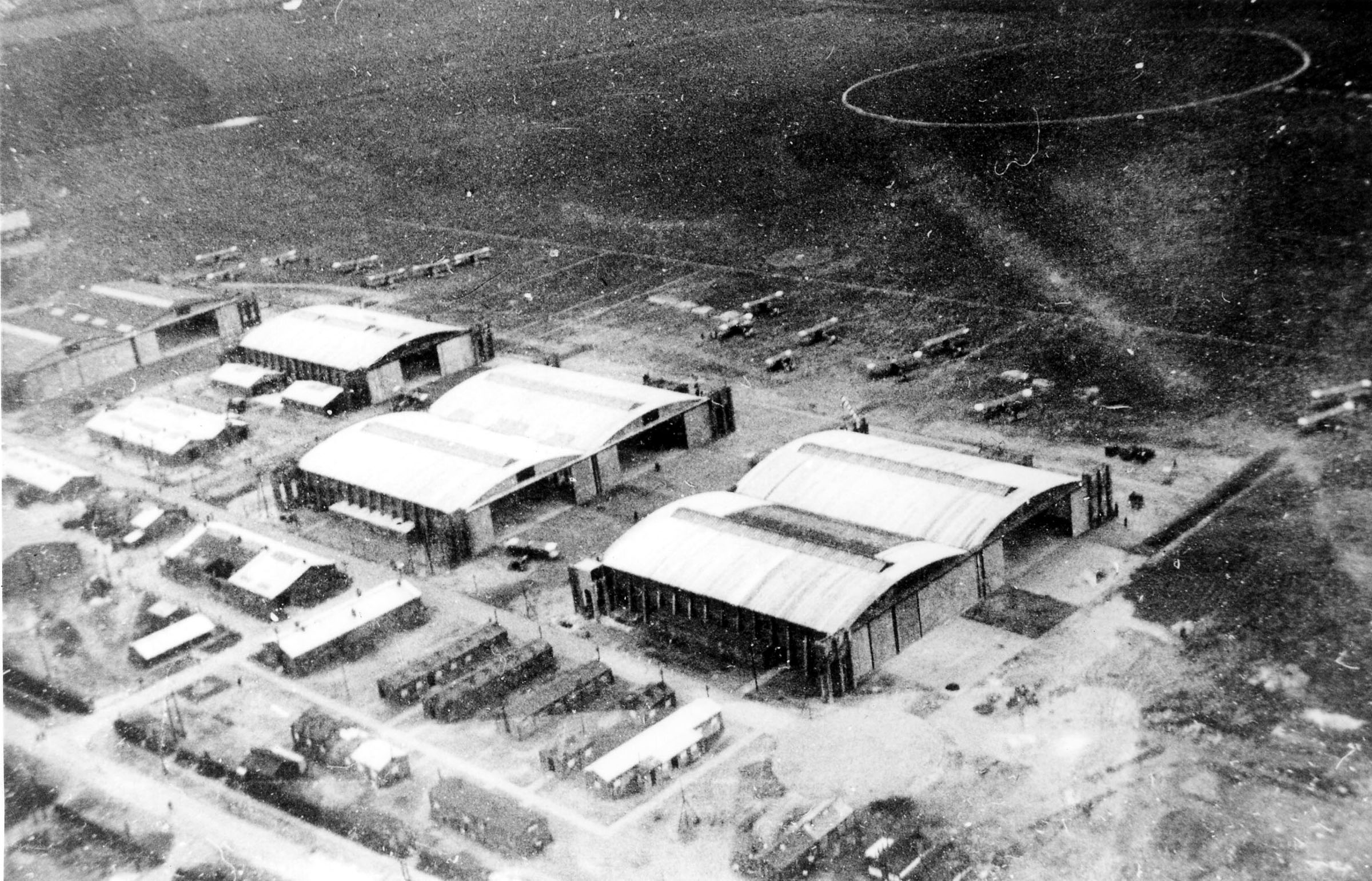 Fowlmere in 1918 showing the three double and one single Belfast Truss hangars on the east side of the Barley-Fowlmere road.  In the original print no fewer than sixteen DH4 or DH9 bombers are visible plus two smaller fighters, possibly Camels.  (Capt D S Glover via Peter Green)