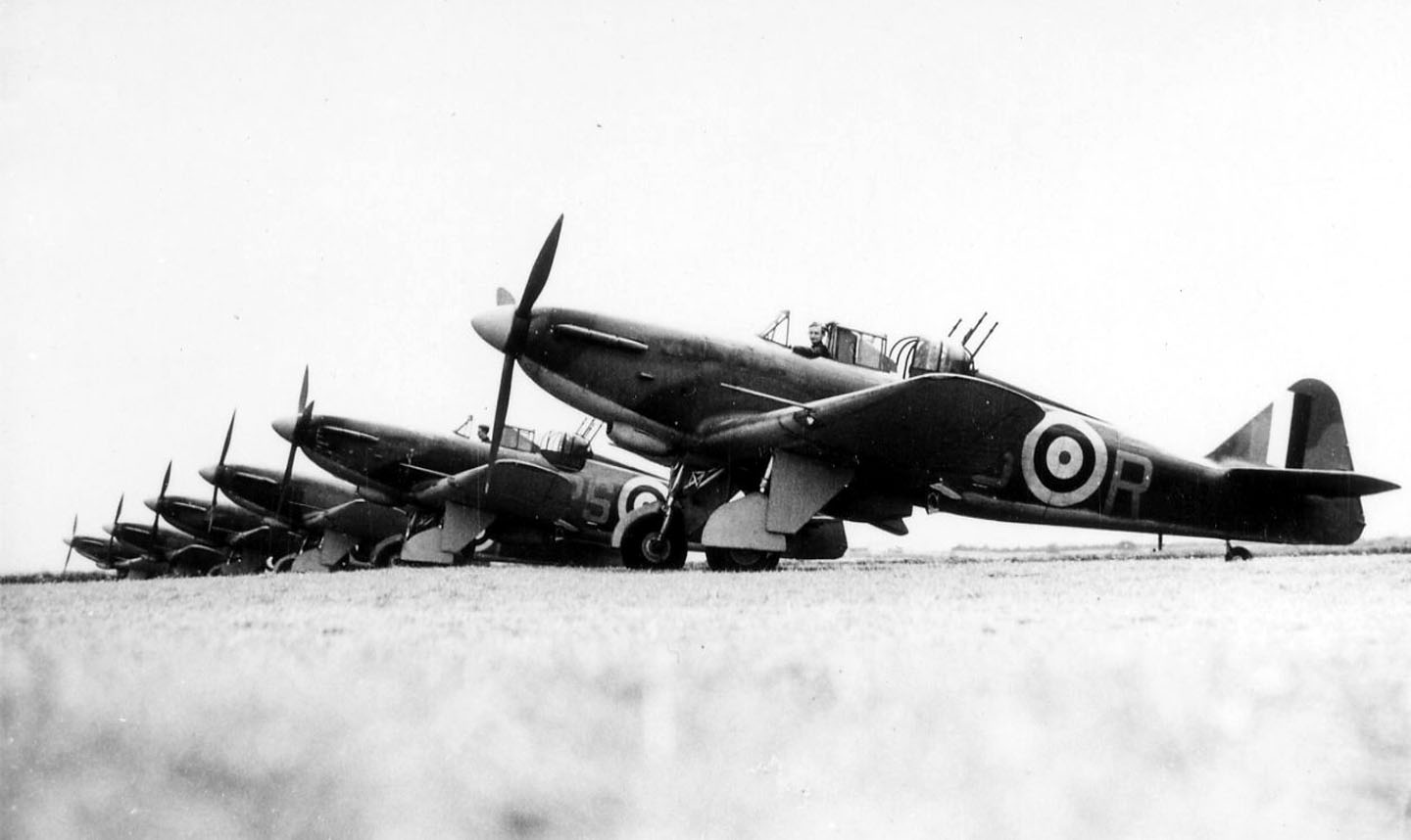 A line-up of Boulton Paul Defiant turret fighters of 264 Sqn which were based at Fowlmere during July 1940.  The turret fighter concept was not a success, the aircraft being too slow for dog-fighting, and the Defiant was soon relegated to night fighting. 